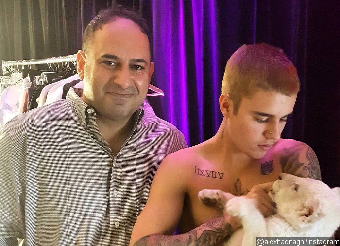 Justin Bieber Slammed by PETA for Posing With Lion Cub