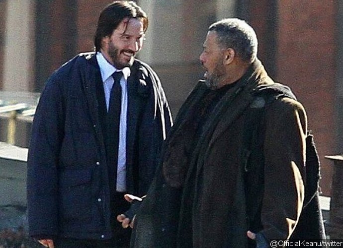 Laurence Fishburne, left, and Keanu Reeves, cast members in John Wick:  Chapter 2, pose together at the premiere of the film at ArcLight Cinemas  on Monday, Jan. 30, 2017, in Los Angeles. (