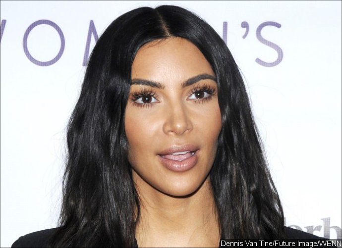 Kim Kardashian Is Basically Topless in Her Ripped Netted Outfit