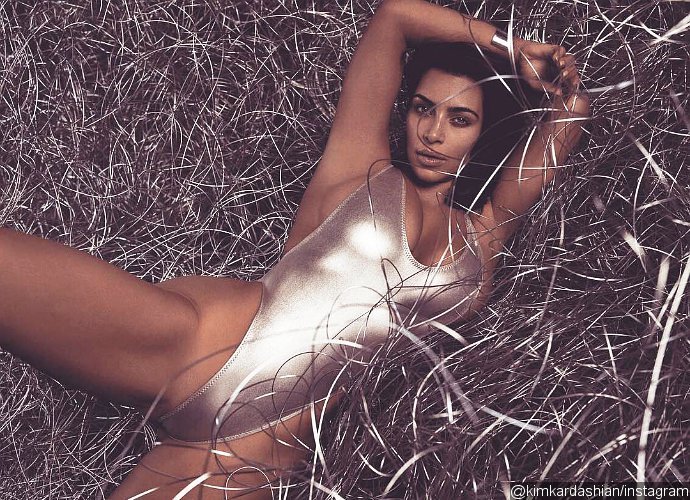 Kim Kardashian Poses in Super Revealing Swimsuit as She Teases Another Racy Photoshoot