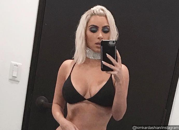 Kim Kardashian Posts Barely-There Bikini Pic After Revealing She Has a 24-Inch Waist