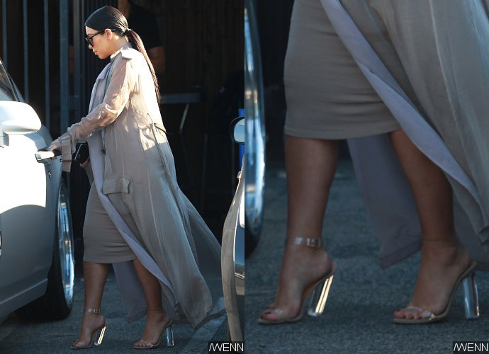 Kim Kardashian Tries to Keep Her Balance as Her Heels Buckle Under the Strain