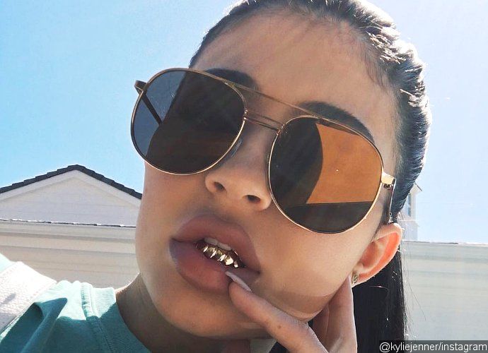 Kylie Jenner Shows Off Her New Accessory, Teeth Grills. Is She Copying Tyga?