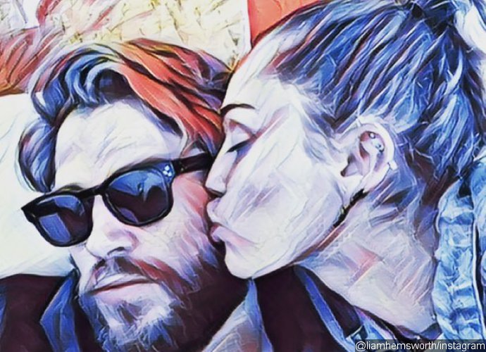 Liam Hemsworth Gets a Sweet Smooch From Miley Cyrus in New Artsy Pic