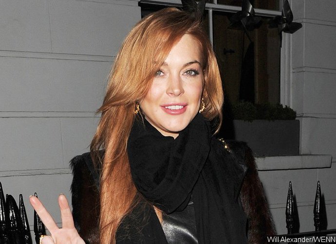 Is Lindsay Lohan Really Pregnant? See Picture of Her Smoking in Sardinia