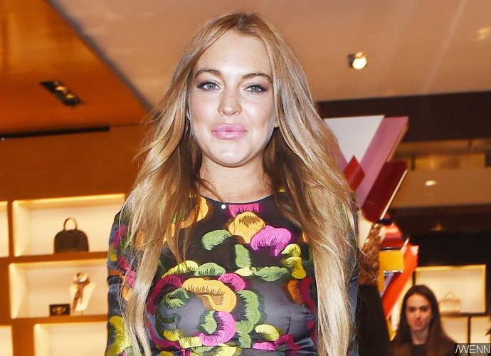 Lindsay Lohan Spotted Drinking, Smoking and Showing Tiny Baby Bump During Vacation