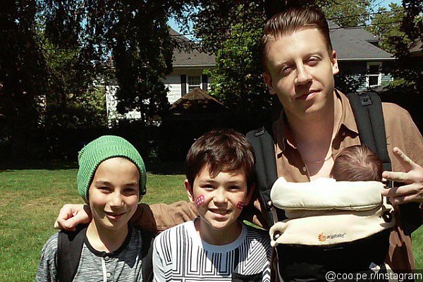 Macklemore Reportedly Welcomes First Child, Is Pictured Carrying a Baby