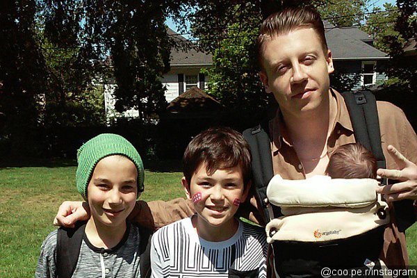 Macklemore Reportedly Welcomes First Child, Is Pictured Carrying a Baby