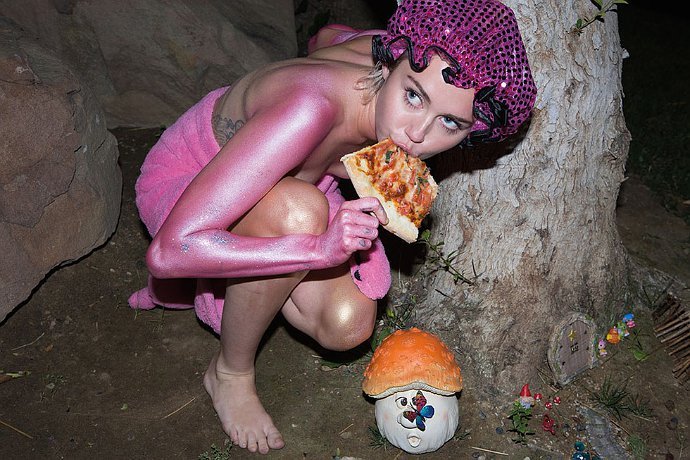 Miley Cyrus Bares Her Breasts, Eats Pizza in New Paper Magazine Picture