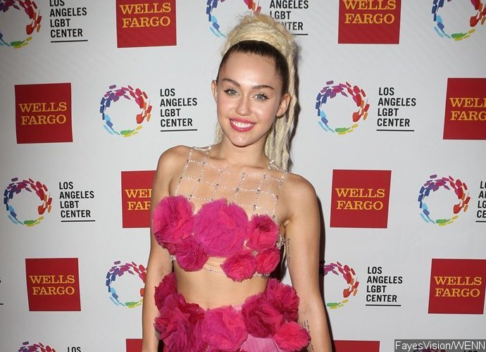 Yikes! Miley Cyrus Shocks Fans With Nipple Piercing Video