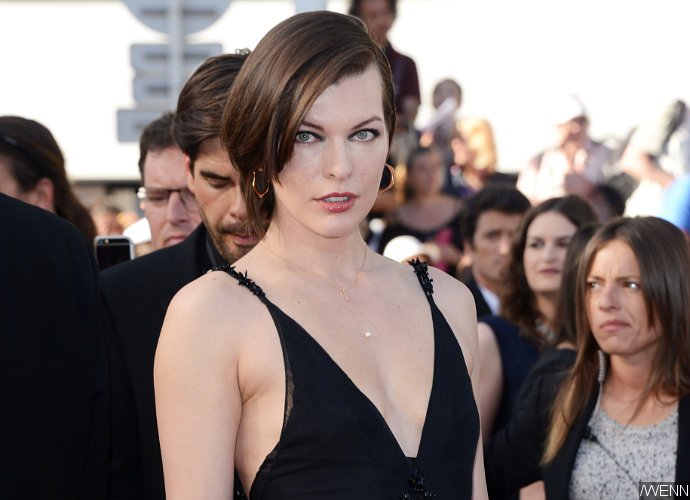 Milla Jovovich Flashes Her Bare Boob During Photo Shoot
