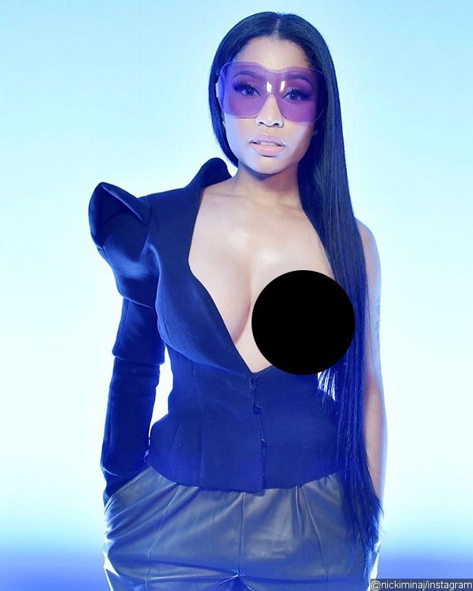 Peek-a-boob! Nicki Minaj Lets Her Entire Boob Hang Out at Paris