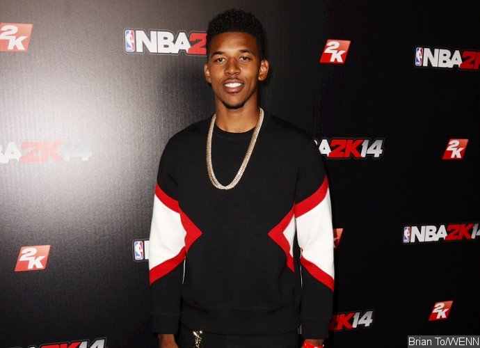 Watch Nick Young Nearly Blow Off His Hand With a Lit Firework