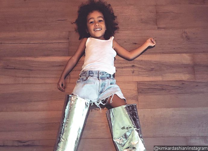 North West Already Steals Mom Kim Kardashian's Shoes. See Her Cutely Posing in $1,700 Boots
