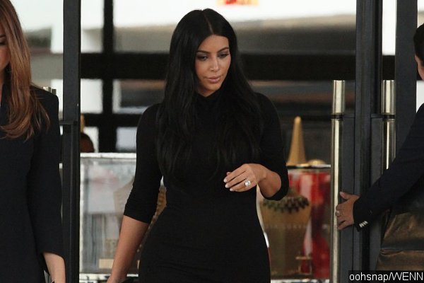 Pregnant Kim Kardashian Flaunts Curves in Skintight Black Dress