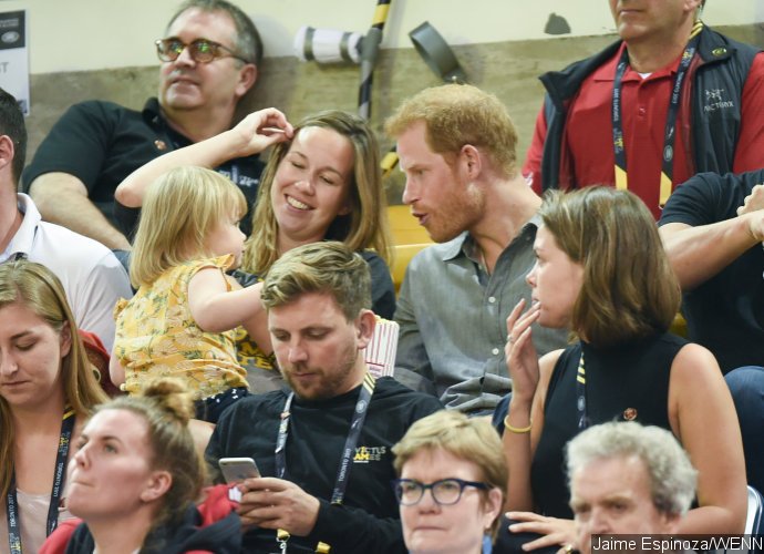 Prince Harry Pens Heartwarming Letter for Athlete's Wife, Makes Faces at Popcorn-Stealing Toddler