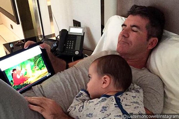 Simon Cowell Cuddles With Son Eric on Latest Tweet Pic