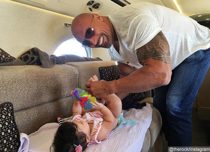 Bring on the Baby Wipes! The Rock Takes on MidFlight Diaper Duty With