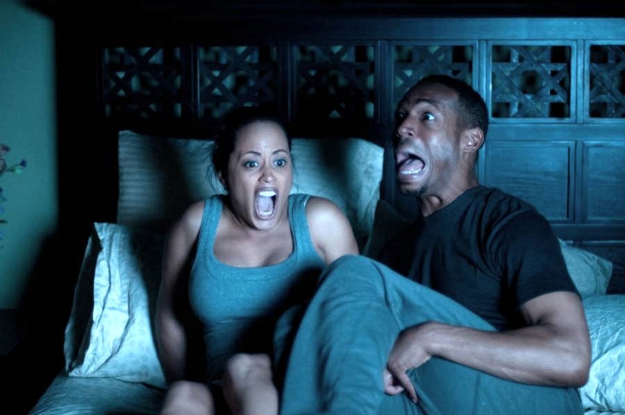 Essence Atkins stars as Keisha and Marlon Wayans stars as Malcolm in Open Road Films' A Haunted House (2013)