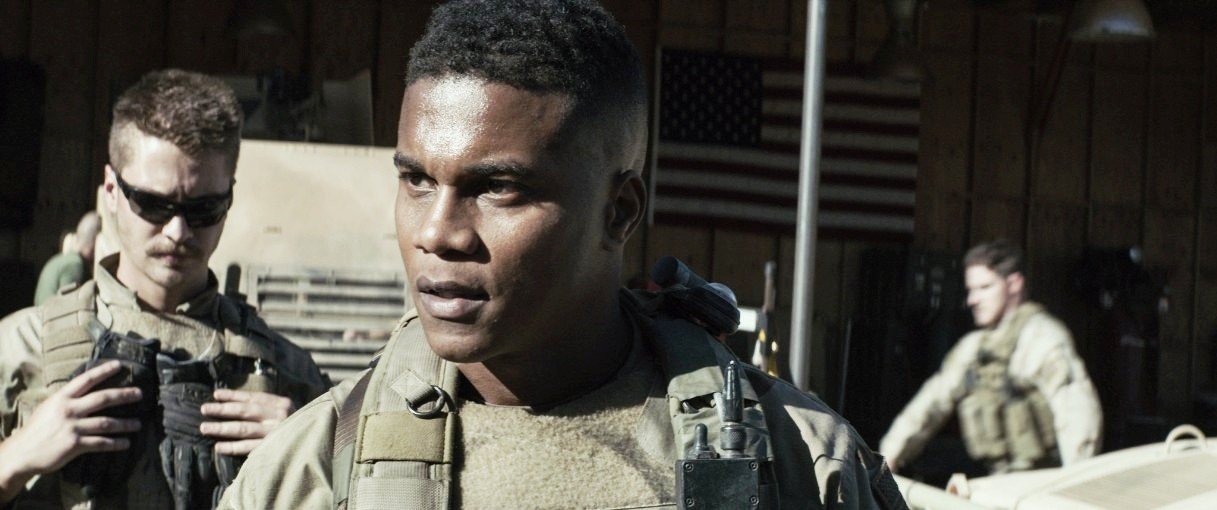 Luke Grimes stars as Marc Lee and Cory Hardrict stars as D in Warner Bros. Pictures' American Sniper (2014)