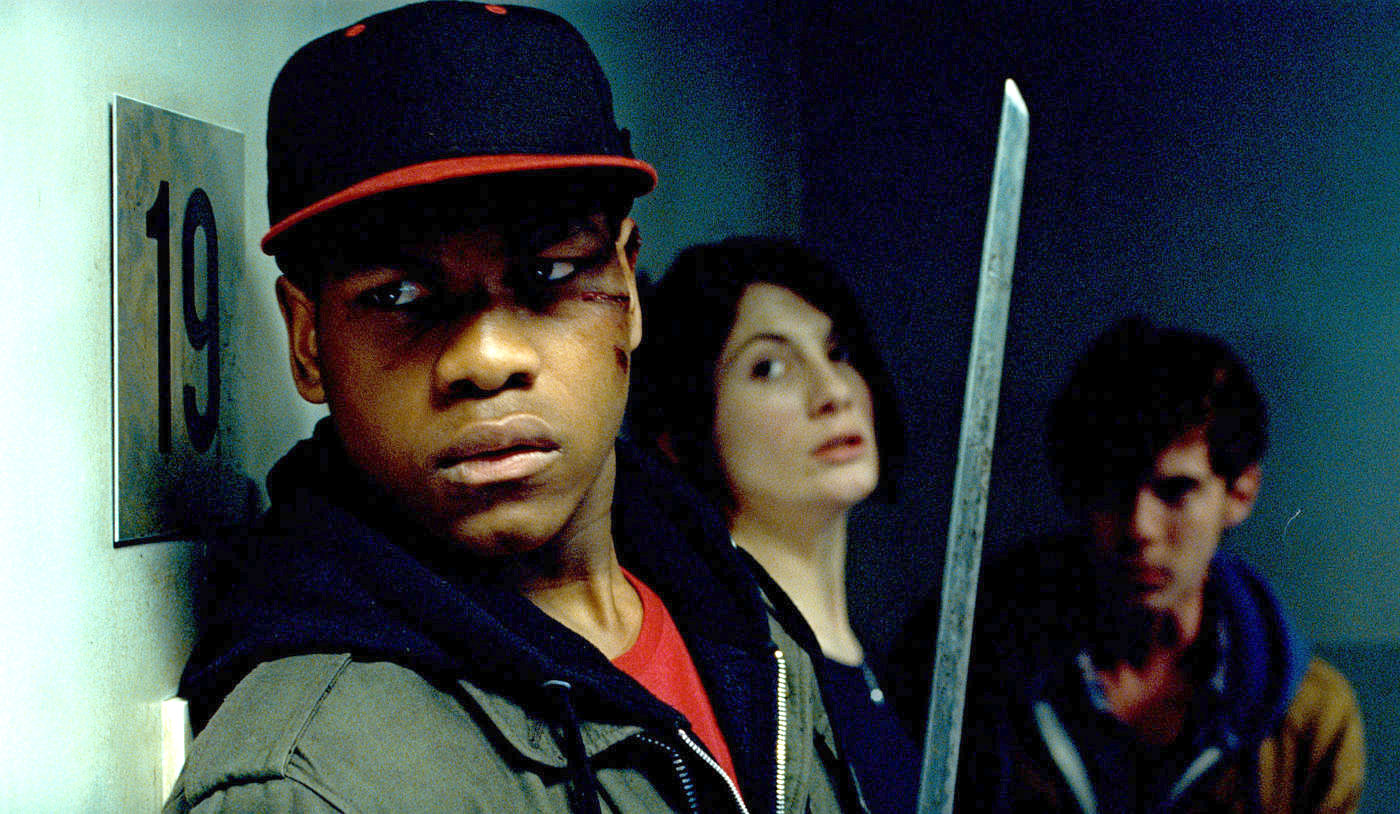 John Boyega stars as Moses and Flaminia Cinque stars as Italian Woman in Screen Gems' Attack the Block (2011)