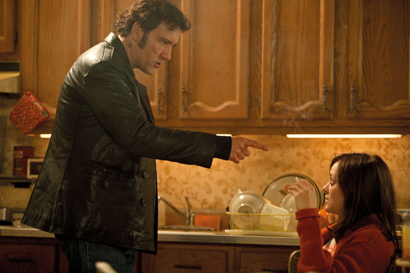 Clive Owen stars as Chris Pierzynski and Marion Cotillard stars as Monica in Roadside Attractions' Blood Ties (2014)