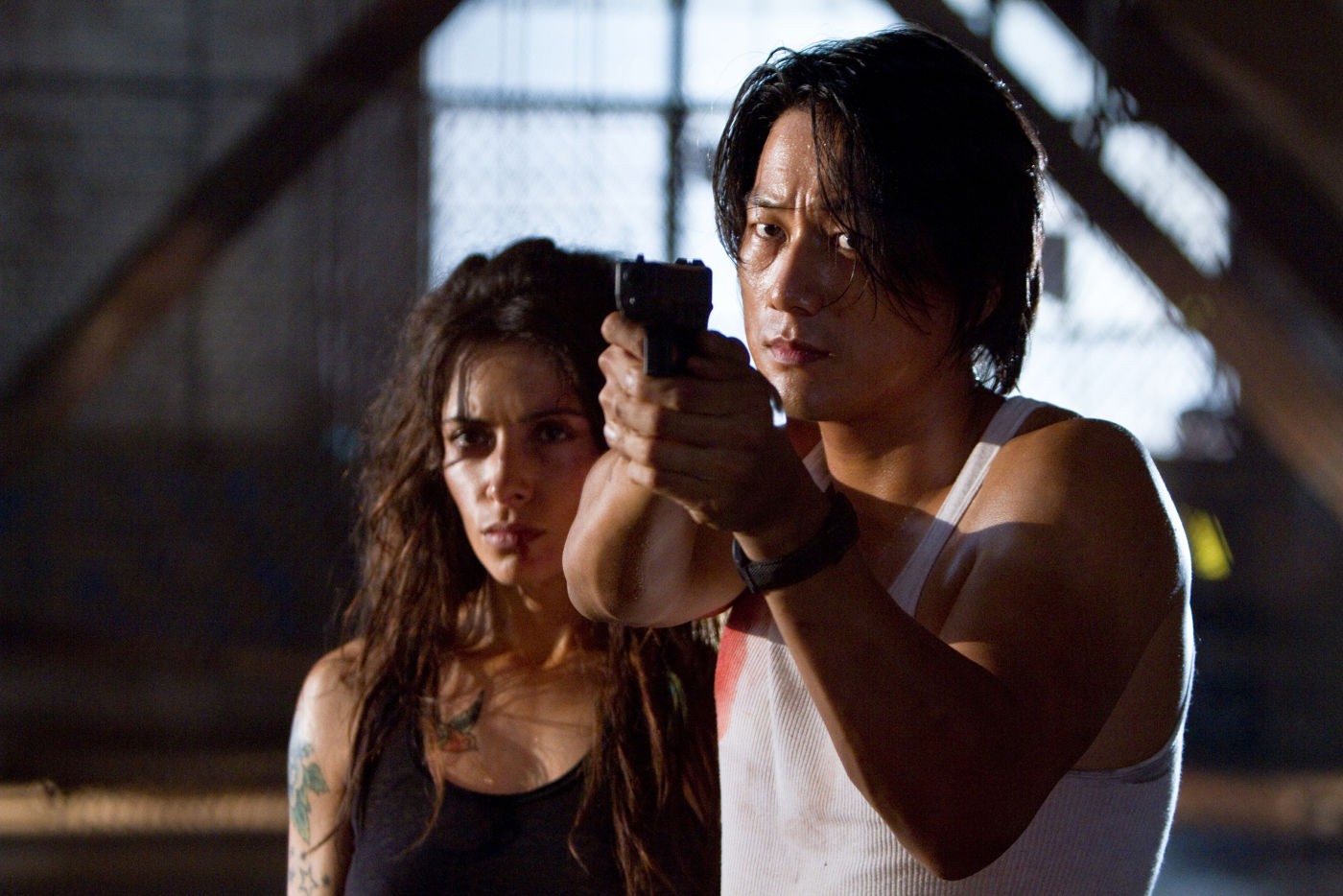 Sarah Shahi stars as Lisa Bobo and Sung Kang stars as Taylor Kwon in Warner Bros. Pictures' Bullet to the Head (2012)