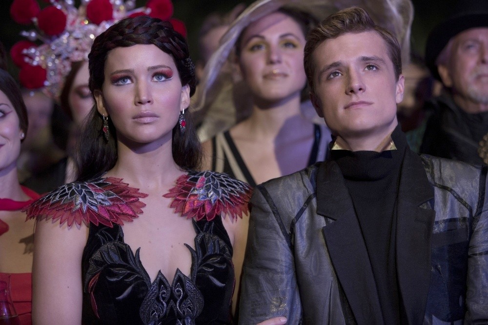 Jennifer Lawrence stars as Katniss Everdeen and Josh Hutcherson stars as Peeta Mellark in Lionsgate Films' The Hunger Games: Catching Fire (2013)