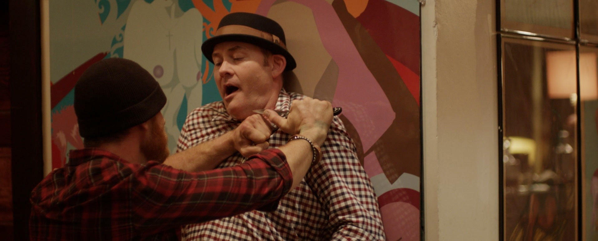 Ethan Embry stars as Vince and David Koechner stars as Colin in Drafthouse Films' Cheap Thrills (2014)