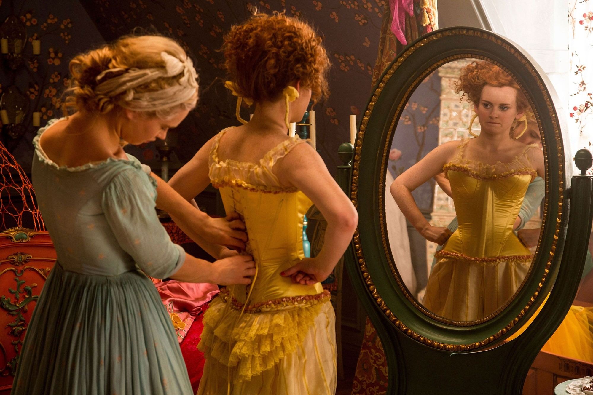 Lily James stars as Cinderella and Sophie McShera stars as Drizella in Walt Disney Pictures' Cinderella (2015)