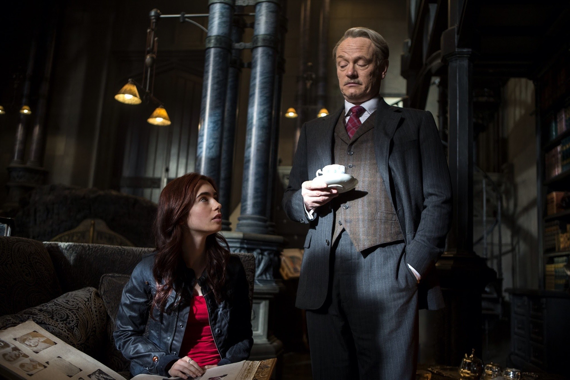 Lily Collins stars as Clary Fray and Jared Harris stars as Hodge in Screen Gems' The Mortal Instruments: City of Bones (2013). Photo credit by Rafy.