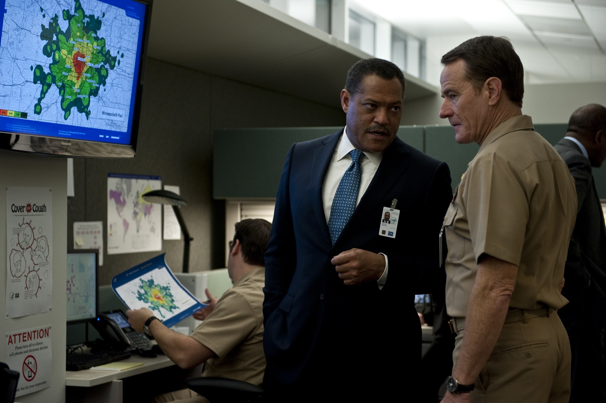 Laurence Fishburne stars as Dr. Ellis Cheever and Bryan Cranston stars as Lyle Haggerty in Warner Bros. Pictures' Contagion (2011)
