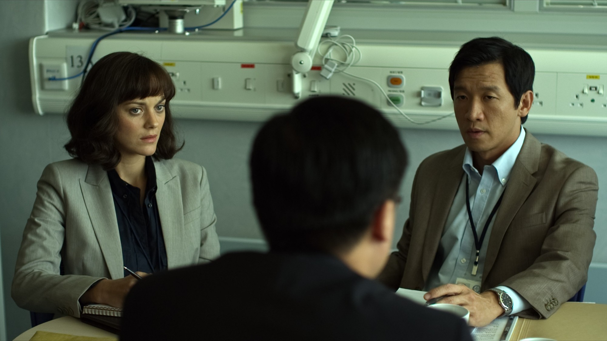 Marion Cotillard stars as Dr. Leonora Orantes and Tien You Chui stars as Li Fai in Warner Bros. Pictures' Contagion (2011)