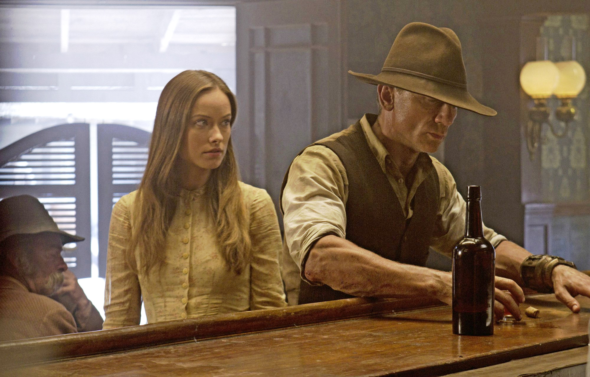 Olivia Wilde stars as Ella and Daniel Craig stars as Jake Lonergan in DreamWorks Pictures' Cowboys and Aliens (2011)