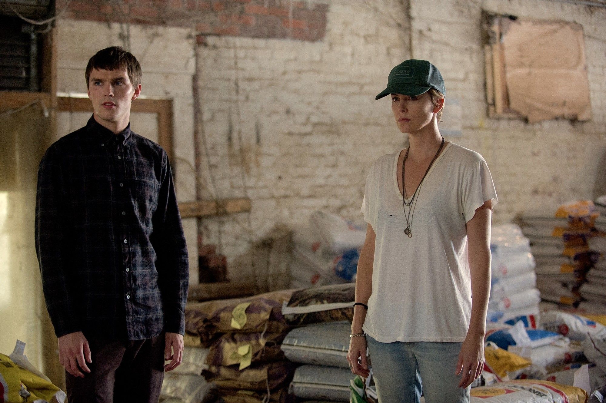 Nicholas Hoult stars as Lyle Wirth and Charlize Theron stars as Libby Day in A24's Dark Places (2015)