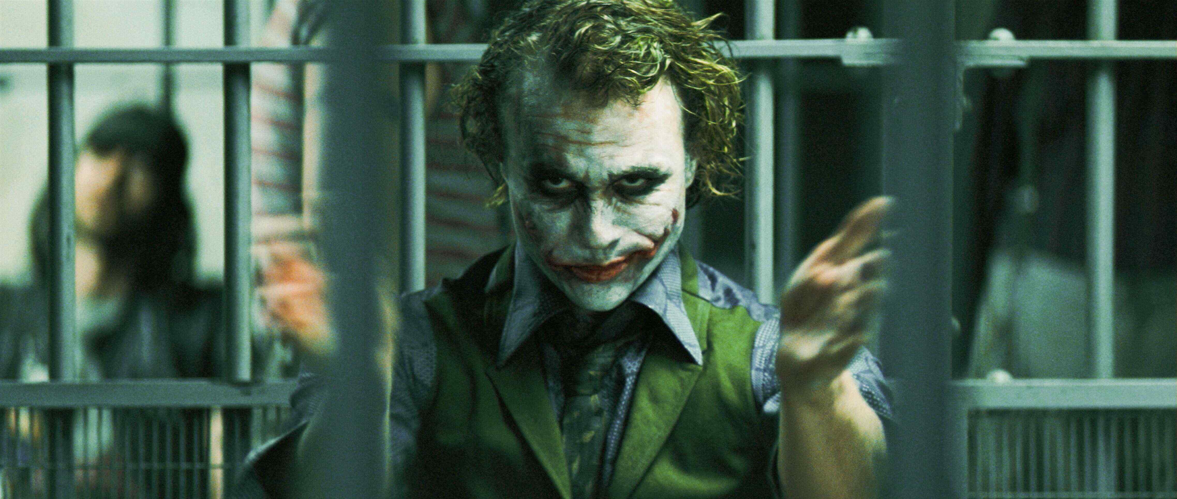 HEATH LEDGER stars as Joker in Warner Bros. Pictures' and Legendary Pictures' action drama 