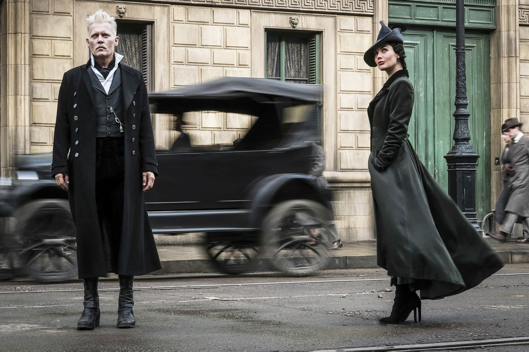 Johnny Depp stars as Gellert Grindelwald and Poppy Corby-Tuech stars as Rosier in Warner Bros. Pictures' Fantastic Beasts: The Crimes of Grindelwald (2018)