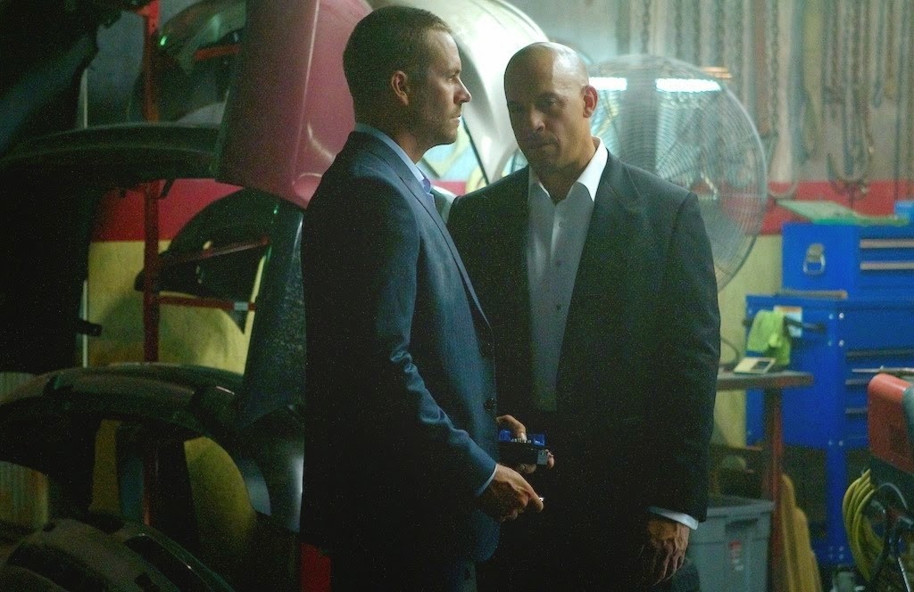 Paul Walker stars as Brian O'Conner and Vin Diesel stars as Dominic Toretto in Universal Pictures' Furious 7 (2015)