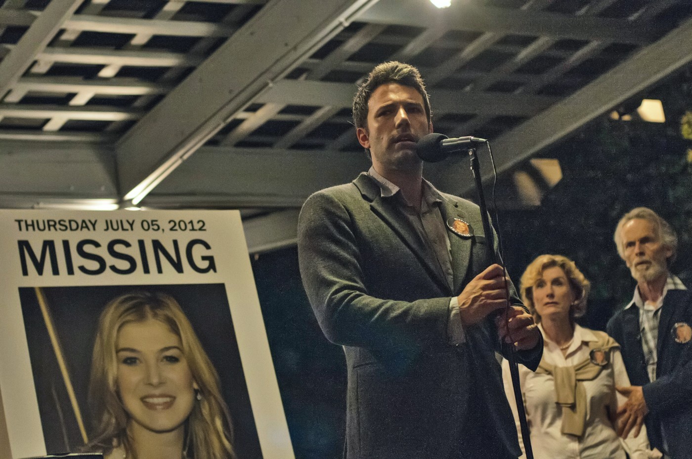 Rosamund Pike stars as Amy Dunne and Ben Affleck stars as Nick Dunne in 20th Century Fox's Gone Girl (2014)