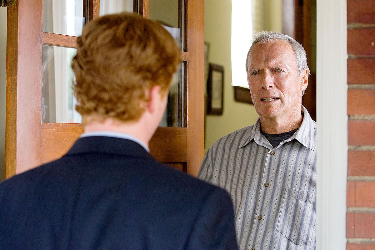 Christopher Carley stars as Father Janovich and Clint Eastwood stars as Walt Kowalski in Warner Bros. Pictures' Gran Torino (2008)