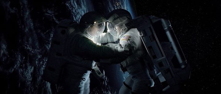 Sandra Bullock stars as Dr. Ryan Stone and George Clooney stars as Matt Kowalsky in Warner Bros. Pictures' Gravity (2013)