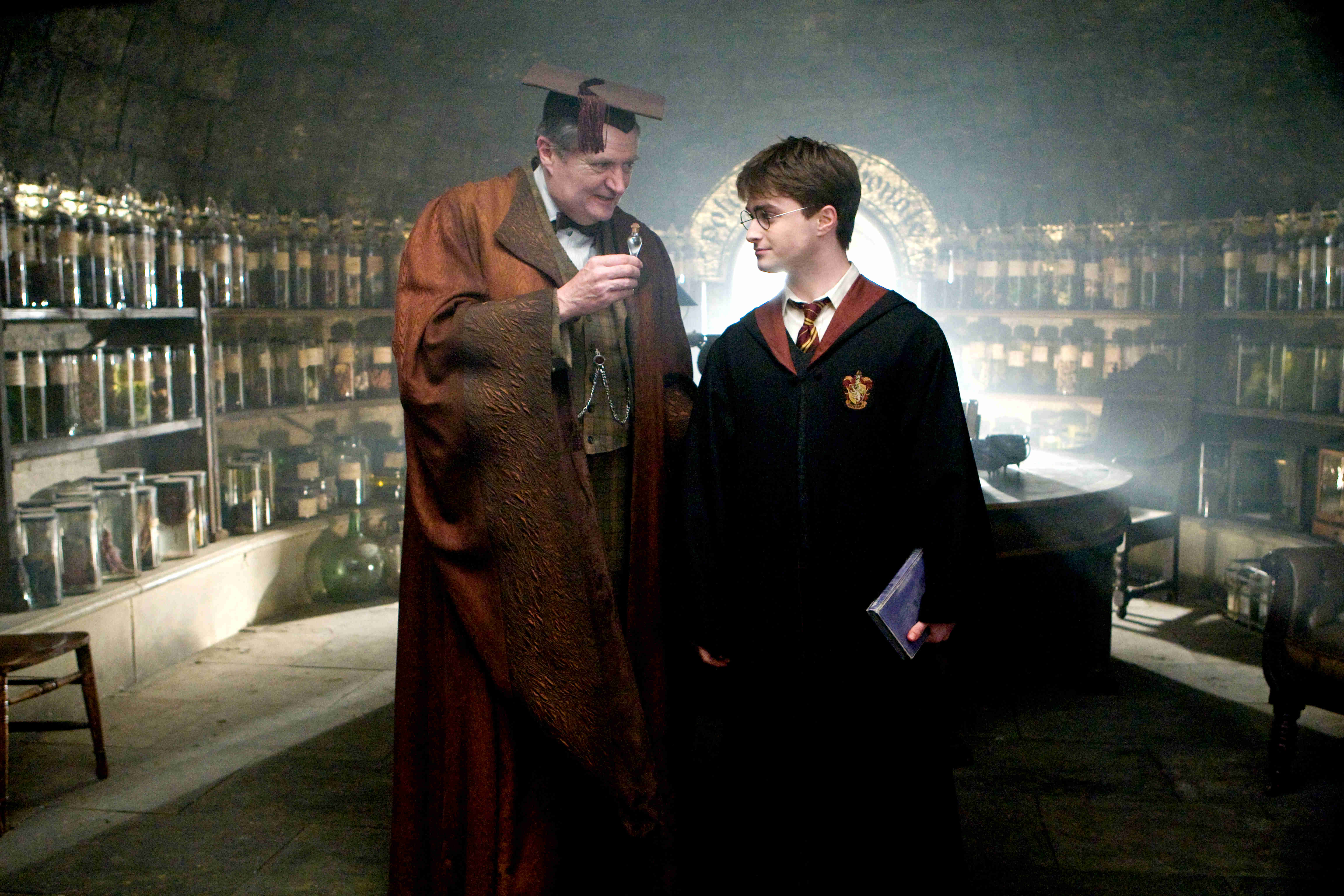 Jim Broadbent stars as Horace Slughorn and Daniel Radcliffe stars as Harry Potter in Warner Bros Pictures' Harry Potter and the Half-Blood Prince (2009)