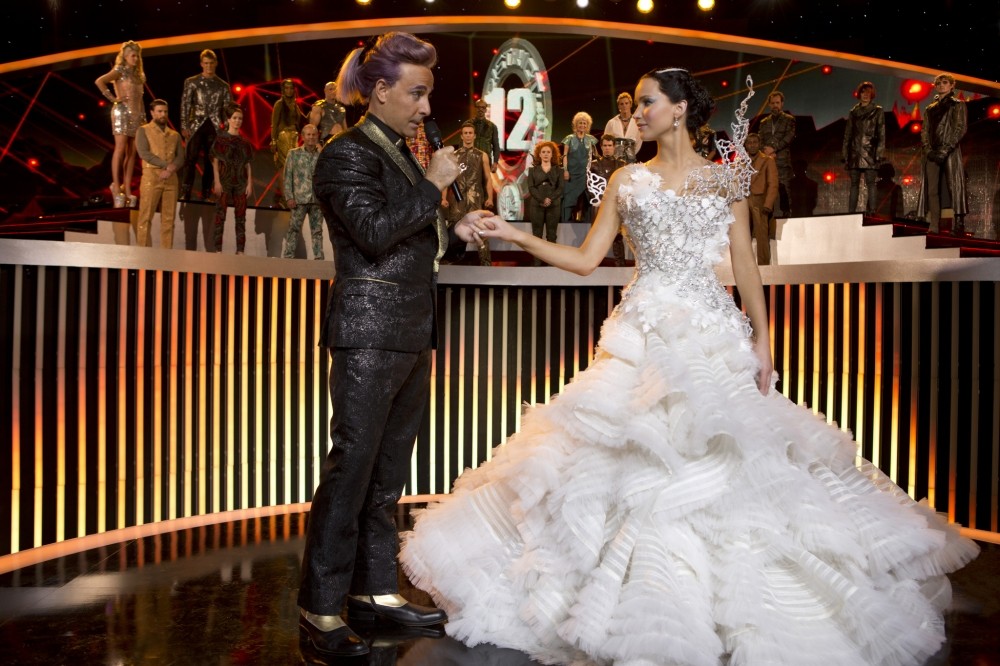 Stanley Tucci stars as Caesar Flickerman and Jennifer Lawrence stars as Katniss Everdeen in Lionsgate Films' The Hunger Games: Catching Fire (2013)