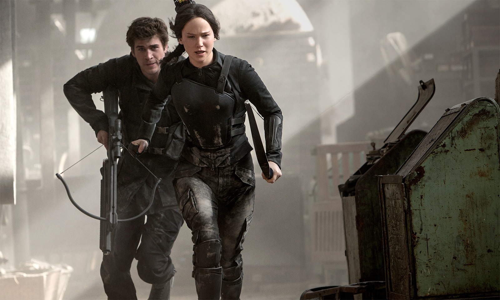 Liam Hemsworth stars as Gale Hawthorne and Jennifer Lawrence stars as Katniss Everdeen in Lionsgate Films' The Hunger Games: Mockingjay, Part 1 (2014)