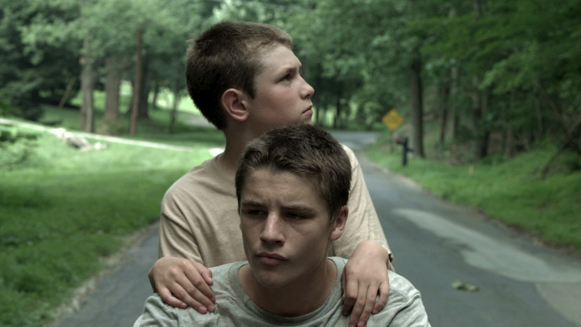 Ryan Jones stars as Tommy and Nathan Varnson stars as Eric in Tribeca Film's Hide Your Smiling Faces (2014)