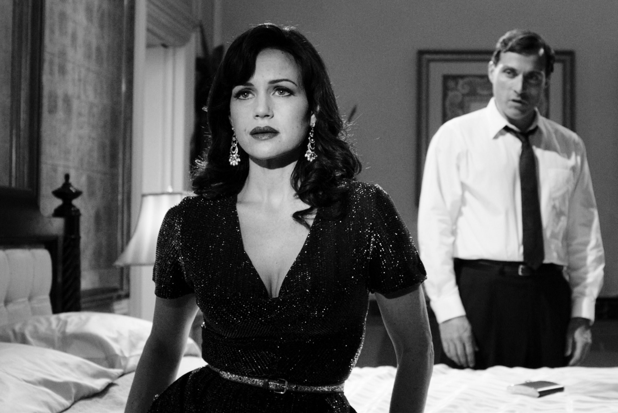 Carla Gugino stars as Hanna Click and Rufus Sewell stars as Felix in Gato Negro Films' Hotel Noir (2012)