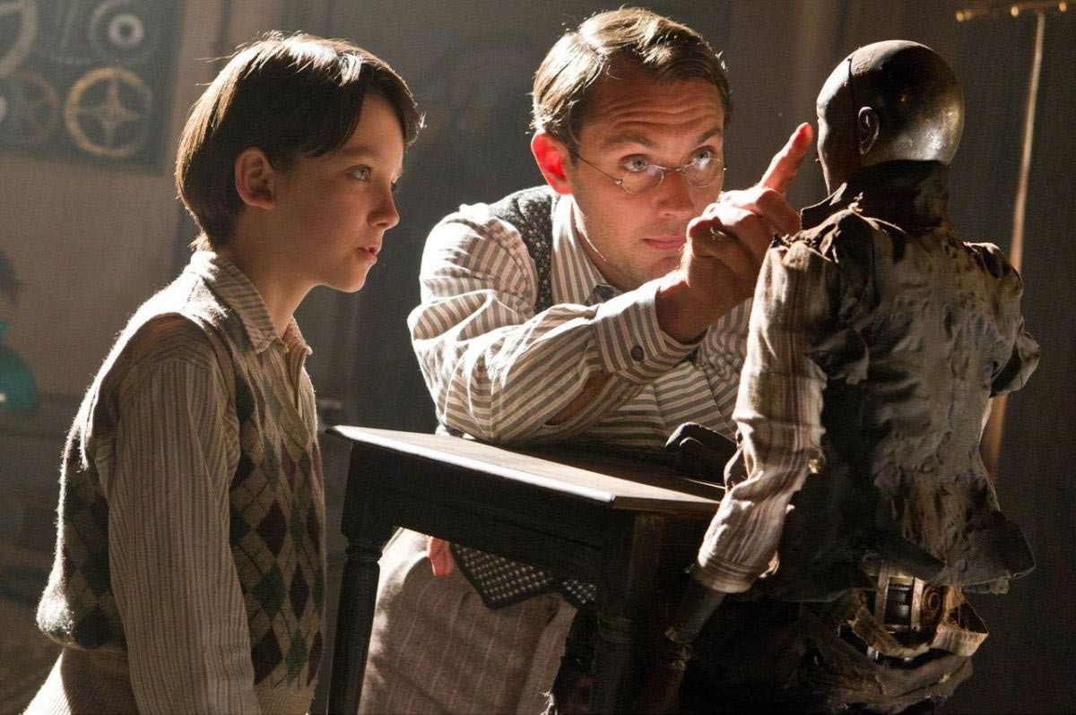 Asa Butterfield stars as Hugo Cabret and Jude Law stars as Hugo's Father in Paramount Pictures' Hugo (2011)