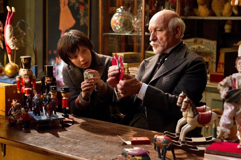 Asa Butterfield stars as Hugo Cabret and Christopher Lee stars as Monsieur Labisseqq in Paramount Pictures' Hugo (2011)