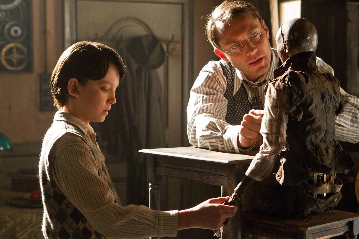 Asa Butterfield stars as Hugo Cabret and Jude Law stars as Hugo's Father in Paramount Pictures' Hugo (2011)