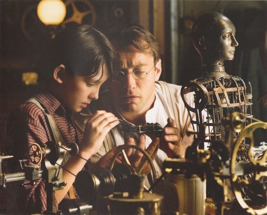 Asa Butterfield stars as Hugo Cabret and Jude Law stars as Hugo's Father in Paramount Pictures' Hugo (2011)